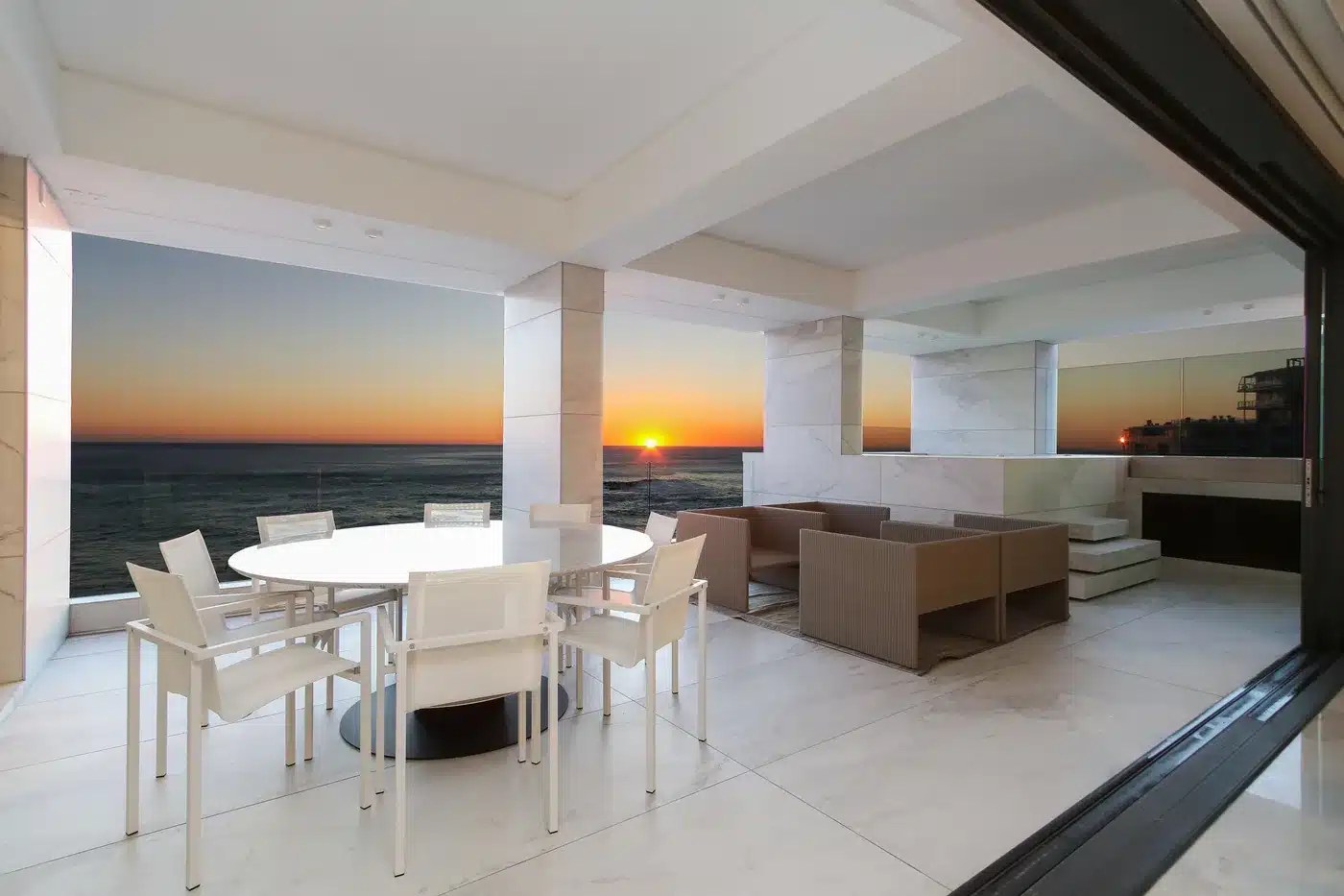 Living space opening to the lawn and ocean